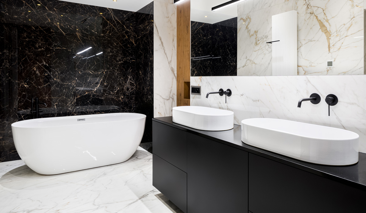 A rendering showing a black and white marble bathroom